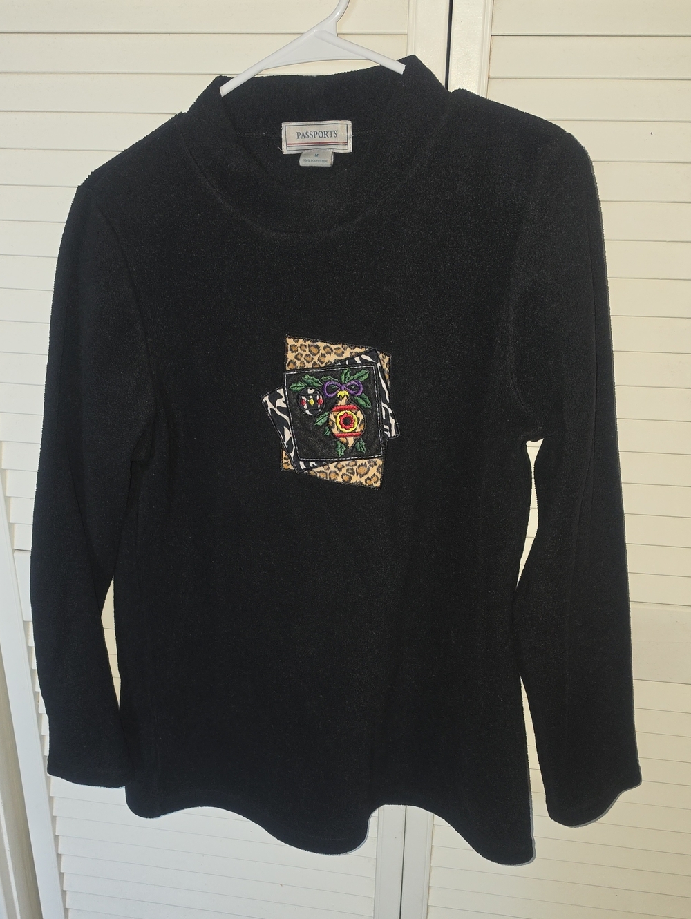 Passport Black Women's Mock Neck Sweater with Embroidered Leopard Patch